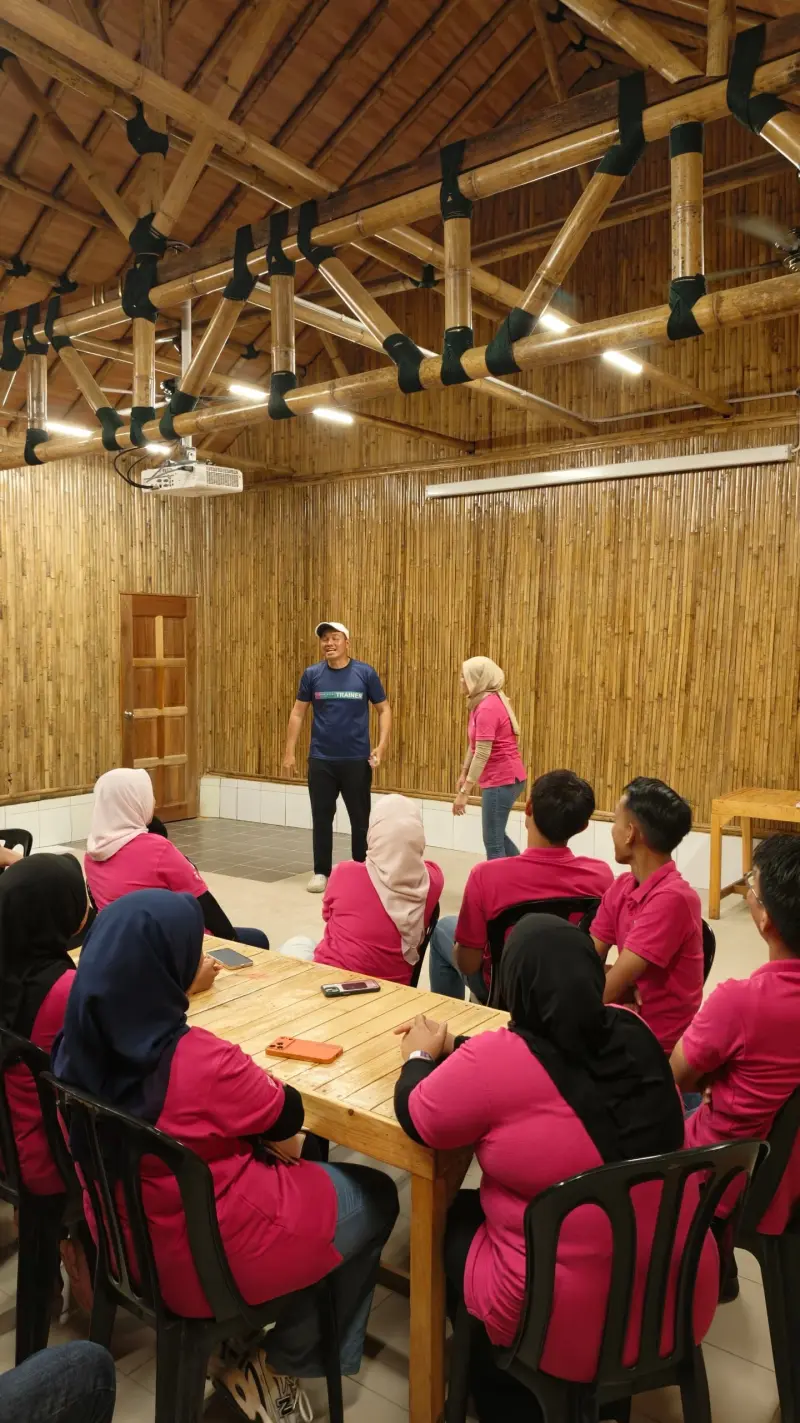 Corporate participants working together during an indoor goal-setting activity