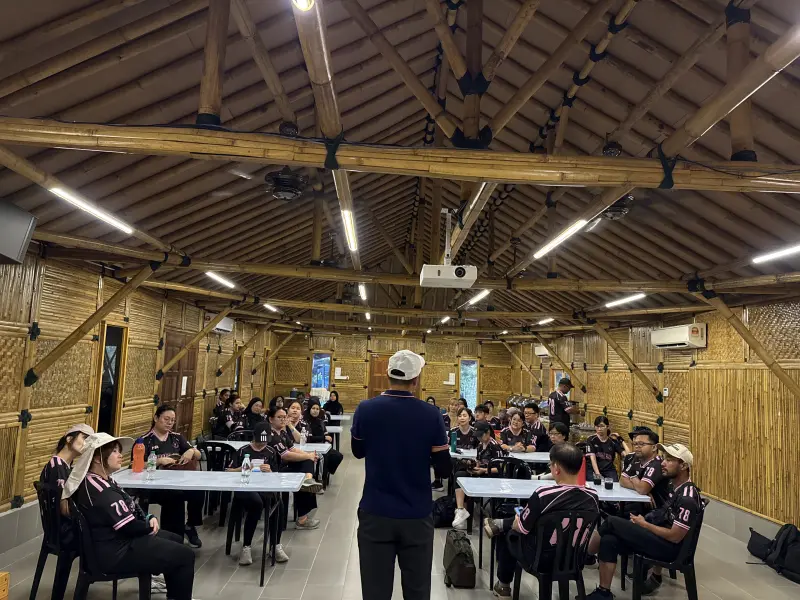 Facilitator leading a corporate leadership and personality workshop indoors
