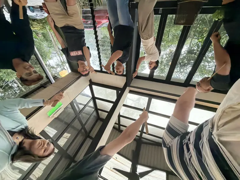 Corporate participants completing an indoor communication challenge